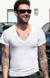 adam levine arms tattoo